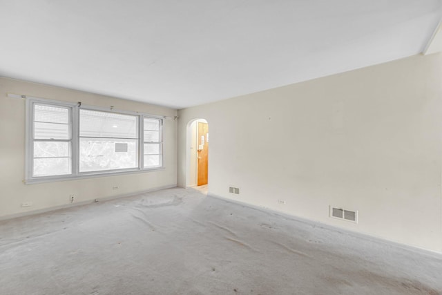 unfurnished room with light carpet