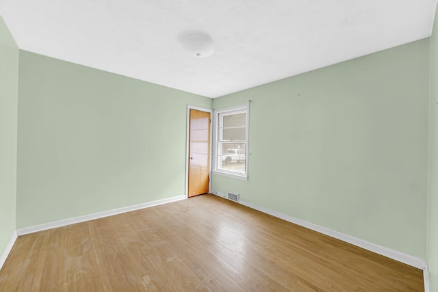 unfurnished room featuring light wood-type flooring