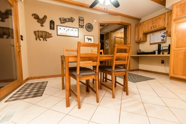 dining room featuring light tile patterned floors and ceiling fan