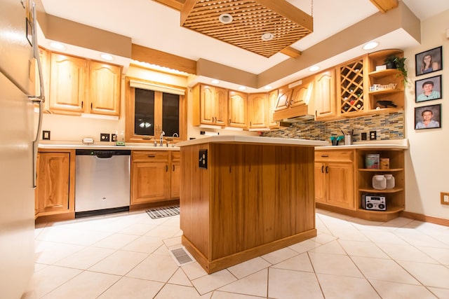 kitchen featuring dishwasher, a kitchen island, decorative backsplash, and light tile patterned floors