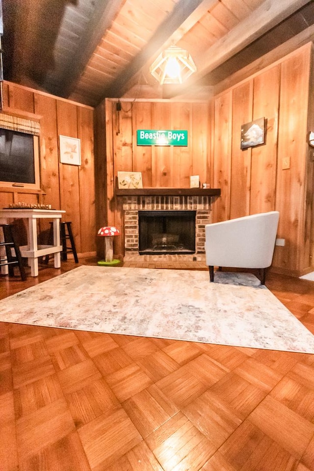 sitting room featuring vaulted ceiling with beams, wooden walls, a fireplace, and wooden ceiling