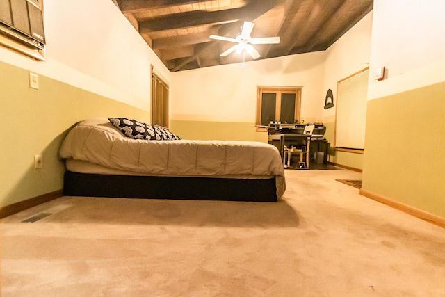 bedroom with carpet, ceiling fan, lofted ceiling with beams, and wooden ceiling