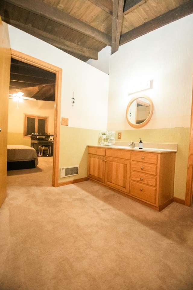 bathroom featuring vanity, ceiling fan, beamed ceiling, and wood ceiling