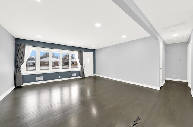 unfurnished living room with dark hardwood / wood-style flooring