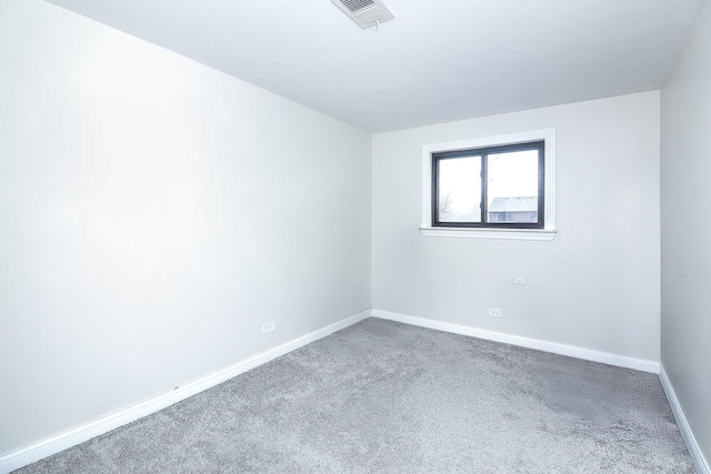 spare room featuring carpet floors