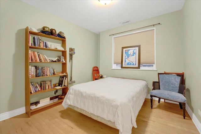 bedroom with light hardwood / wood-style floors