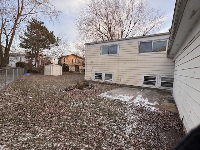 exterior space featuring a shed and a patio