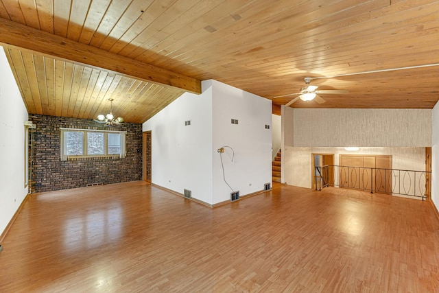 unfurnished living room with brick wall, wood ceiling, ceiling fan with notable chandelier, lofted ceiling with beams, and hardwood / wood-style flooring