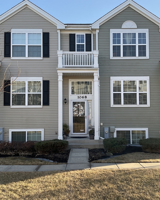 view of front of home with a balcony