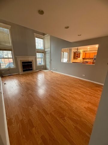 unfurnished living room with light hardwood / wood-style flooring