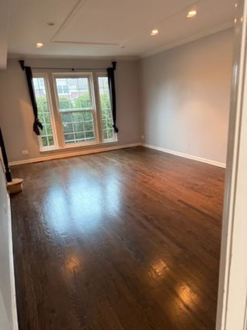 spare room featuring dark hardwood / wood-style flooring