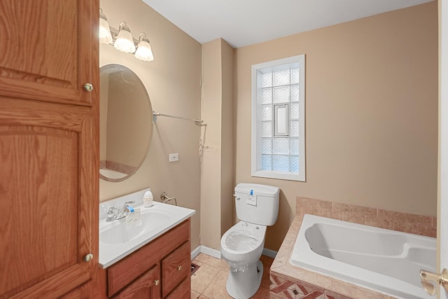 bathroom with toilet, tile patterned flooring, vanity, and tiled bath