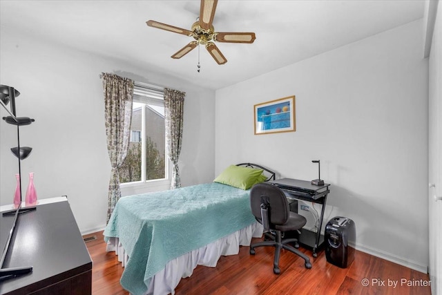 bedroom with hardwood / wood-style flooring and ceiling fan