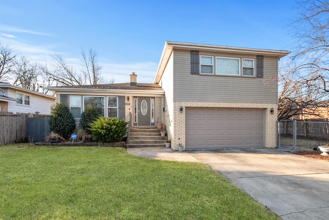 split level home featuring a front lawn, fence, an attached garage, brick siding, and a chimney