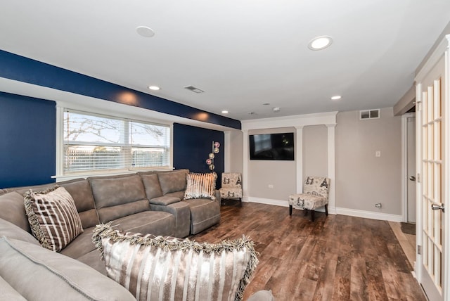 living room with visible vents, recessed lighting, baseboards, and wood finished floors