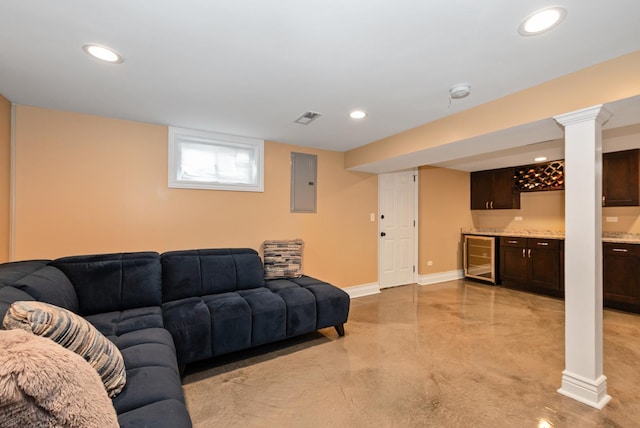 living area with visible vents, electric panel, wine cooler, indoor wet bar, and baseboards