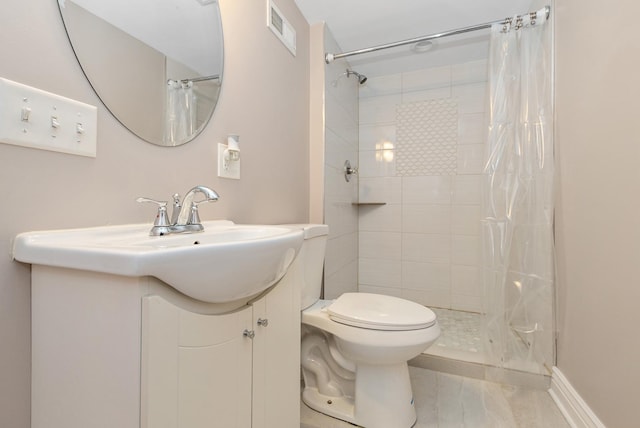 full bath with vanity, toilet, visible vents, and a tile shower