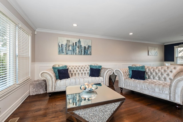 living room featuring recessed lighting, wainscoting, wood finished floors, and crown molding