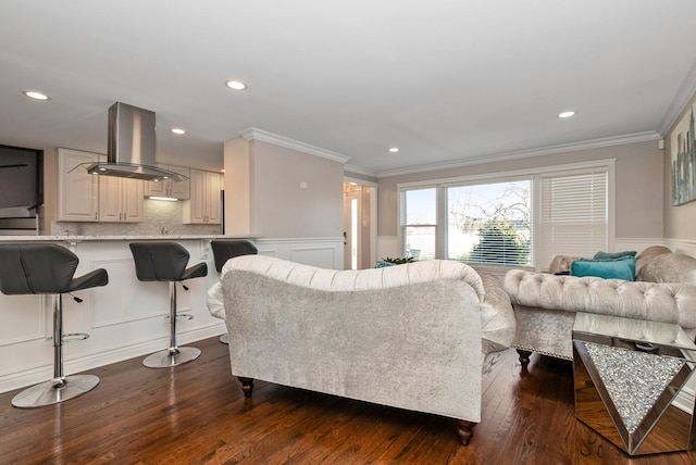 living room featuring recessed lighting, dark wood-type flooring, and ornamental molding