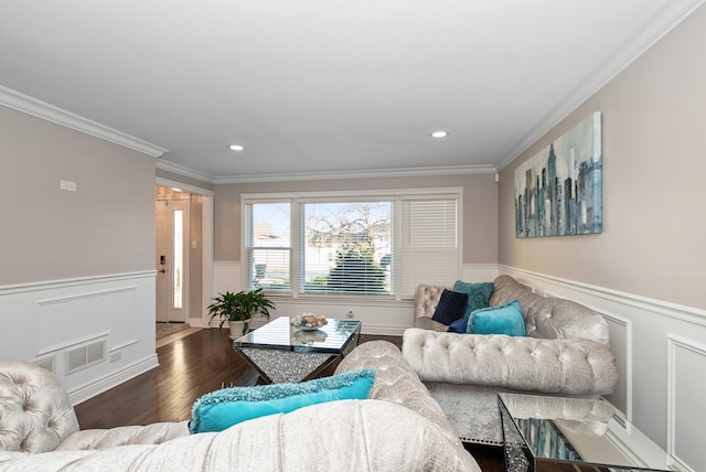 living area featuring recessed lighting, a wainscoted wall, wood finished floors, and ornamental molding