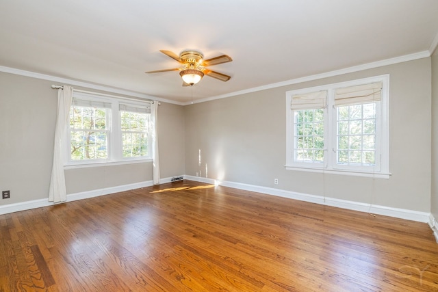 spare room with ceiling fan, hardwood / wood-style floors, and ornamental molding