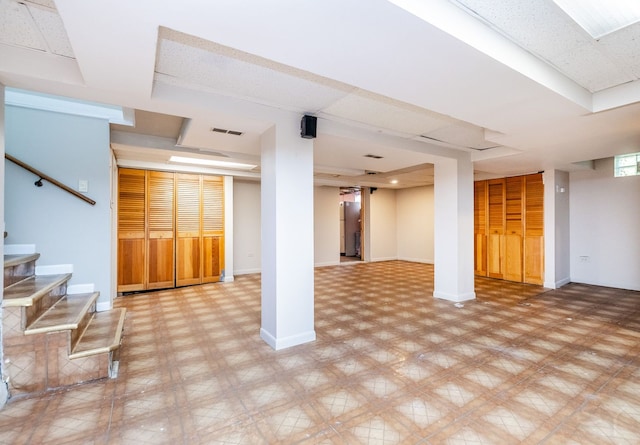 basement with stainless steel refrigerator