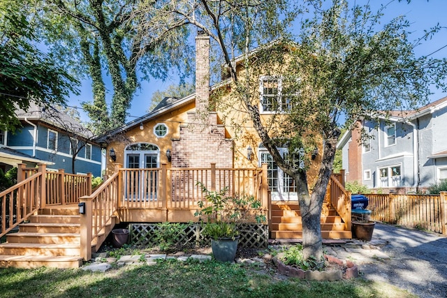 rear view of house featuring a deck