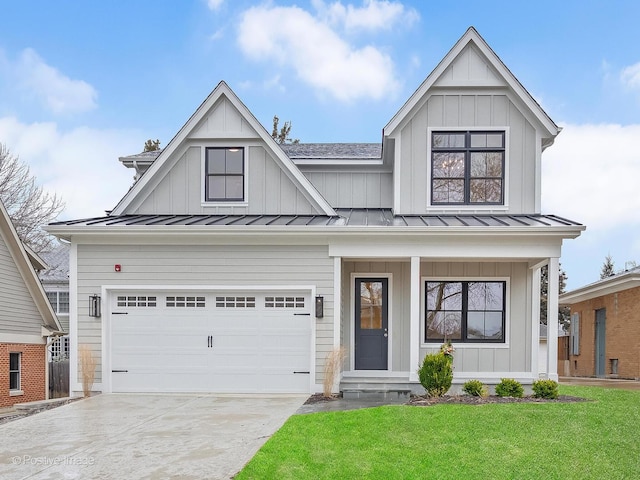 modern farmhouse featuring a garage and a front yard