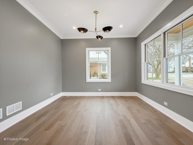 unfurnished dining area with light hardwood / wood-style flooring and ornamental molding