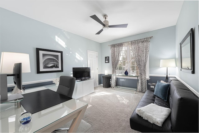 home office with ceiling fan and light colored carpet