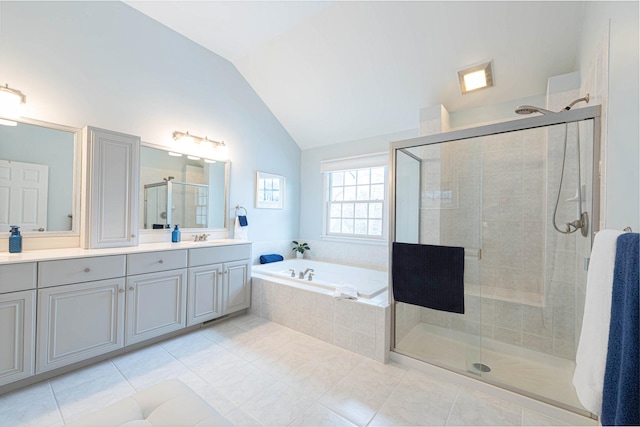 bathroom with vaulted ceiling, tile patterned flooring, plus walk in shower, and vanity