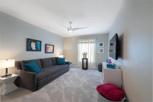 living room featuring ceiling fan and light colored carpet