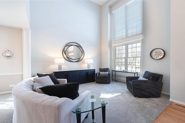 living room featuring a high ceiling