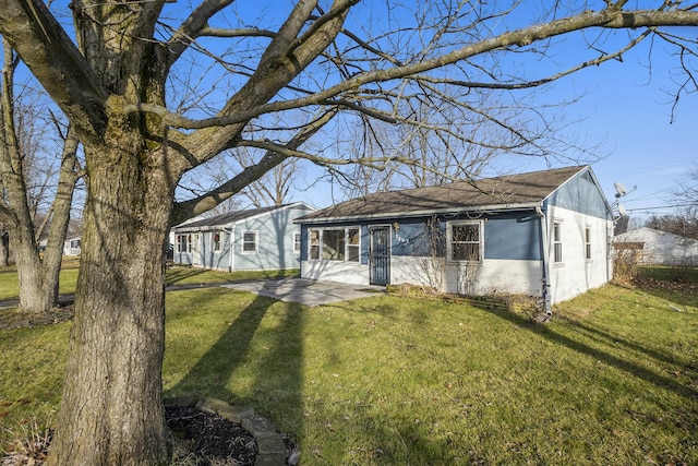 ranch-style home with a front lawn