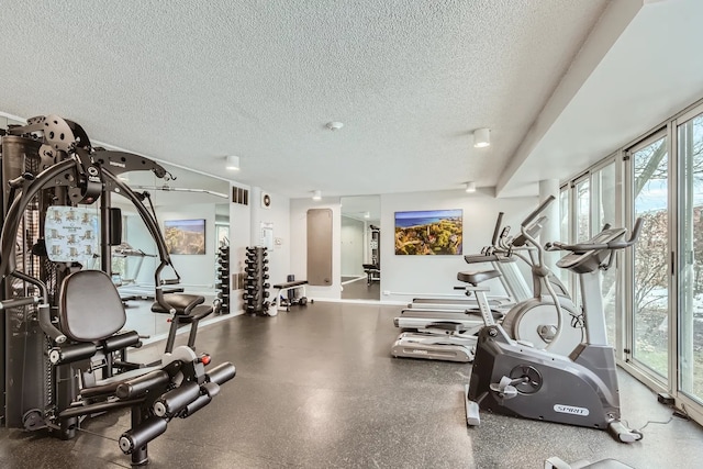 exercise room featuring a textured ceiling