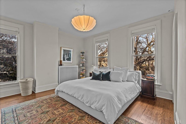 bedroom featuring dark hardwood / wood-style flooring