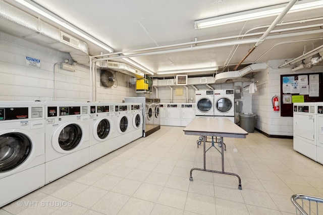 laundry area with independent washer and dryer