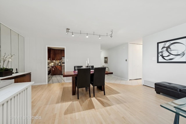 dining room with light wood-type flooring