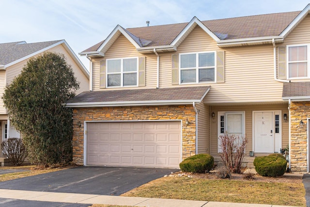 multi unit property featuring a garage