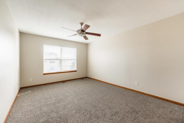 carpeted empty room with ceiling fan