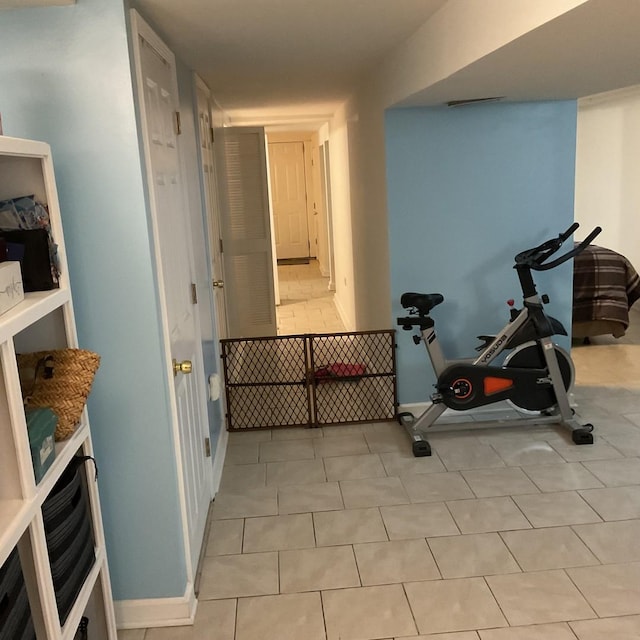 exercise area with light tile patterned floors