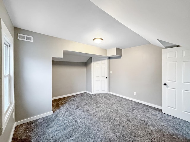 interior space with dark colored carpet