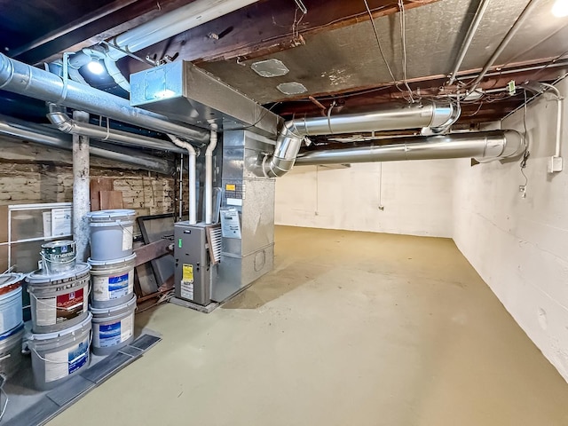 basement featuring heating unit