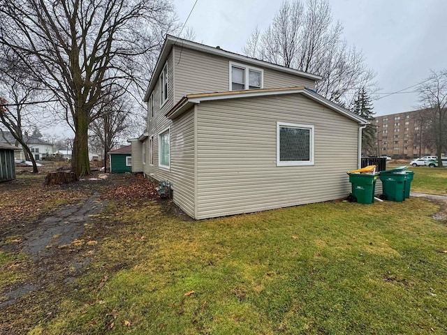 view of property exterior with a lawn