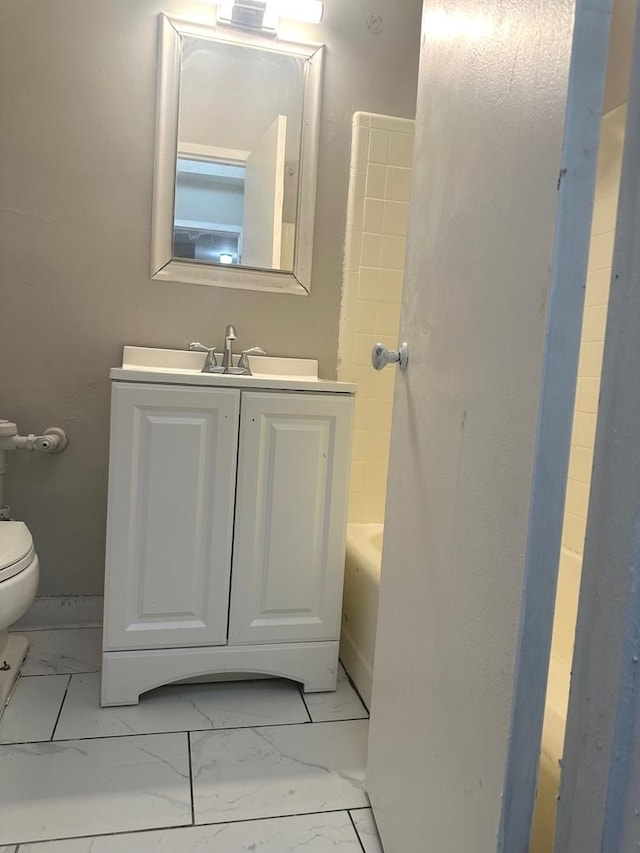 bathroom with toilet and vanity