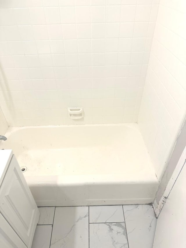 bathroom featuring vanity and a bathing tub