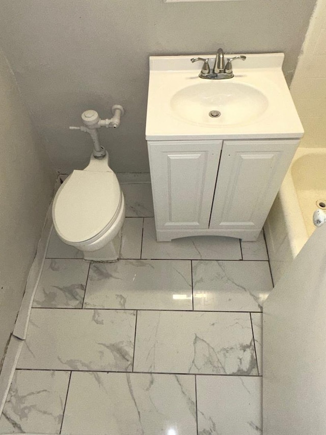 bathroom with toilet and vanity