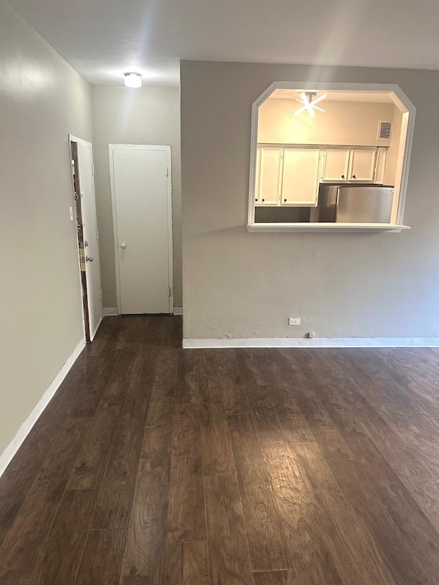 empty room with dark hardwood / wood-style floors