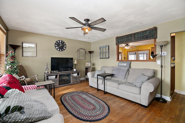 living room with plenty of natural light and hardwood / wood-style flooring