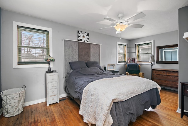 bedroom with hardwood / wood-style floors and ceiling fan